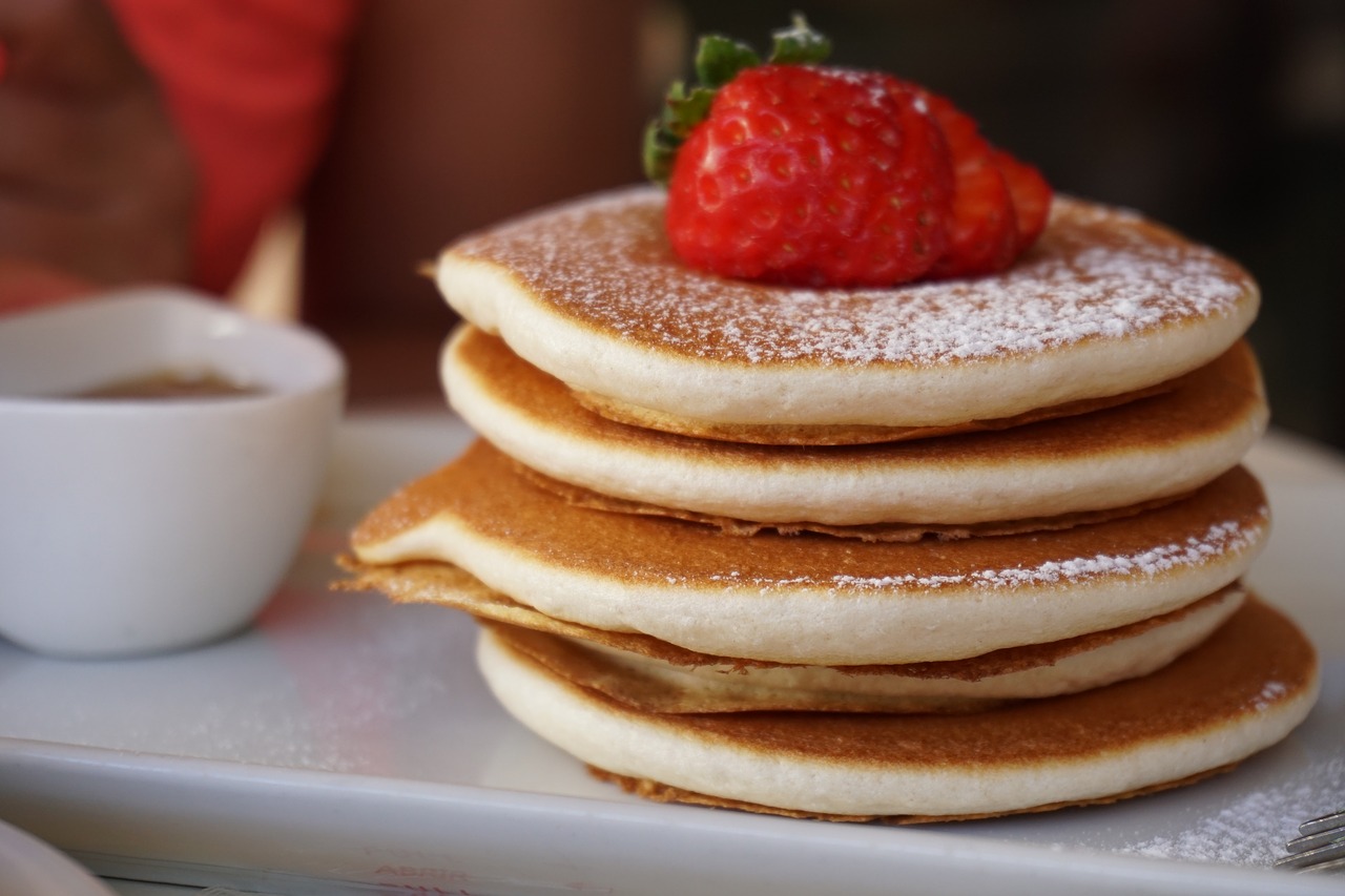 Pancakes with strawberries on top